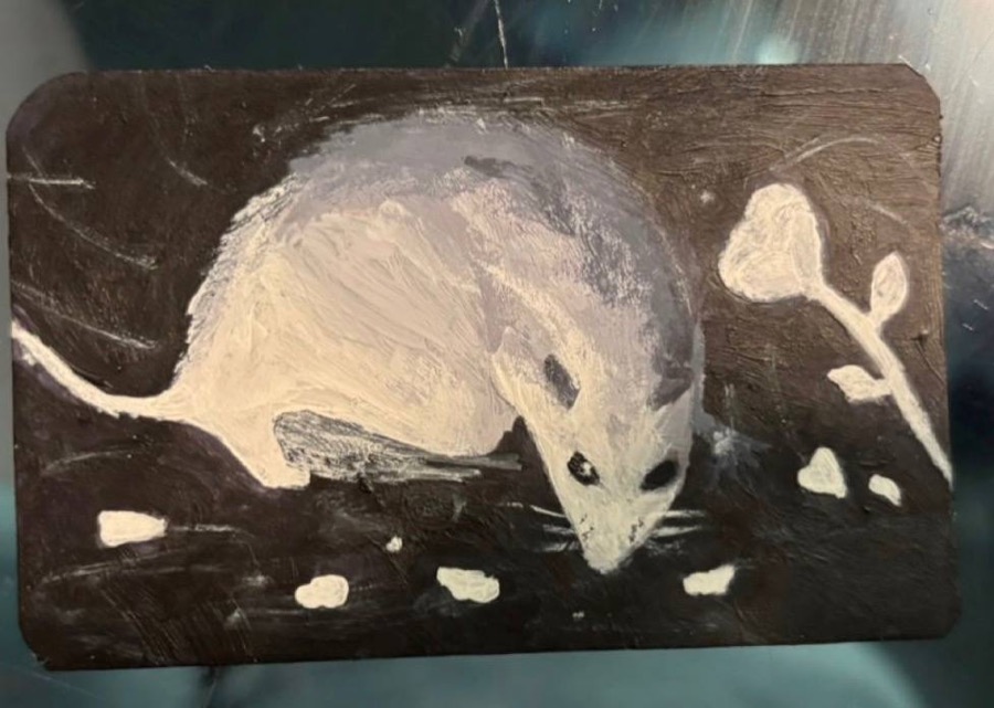 Opossum painting on a wooden charm, by Maiia