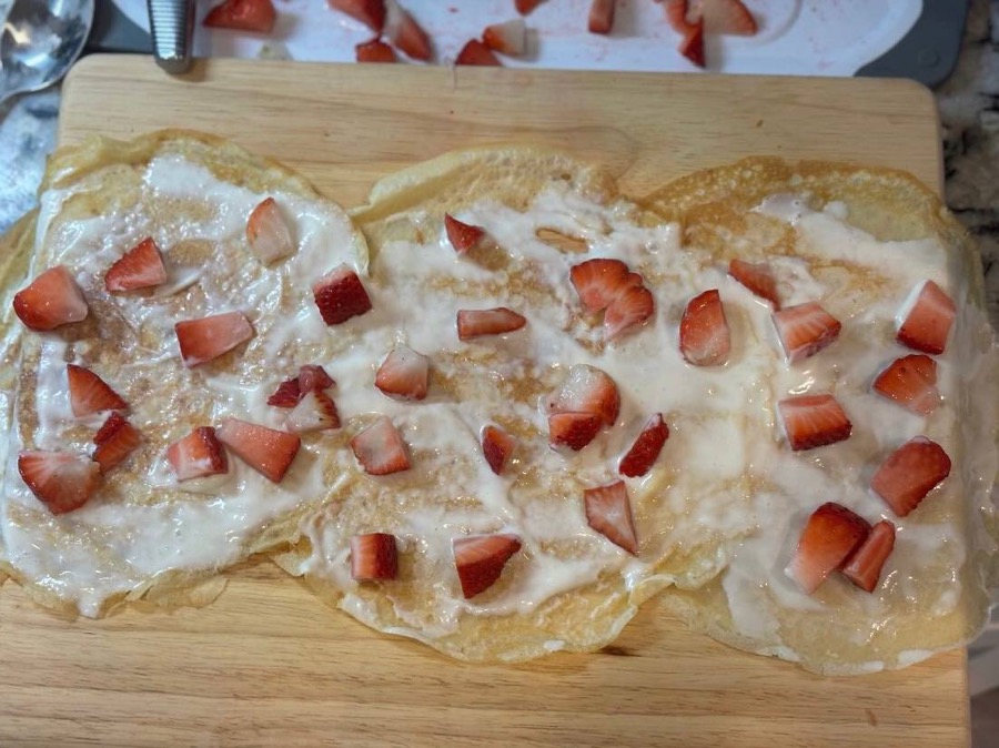 Strawberries and cream stuffed crepes